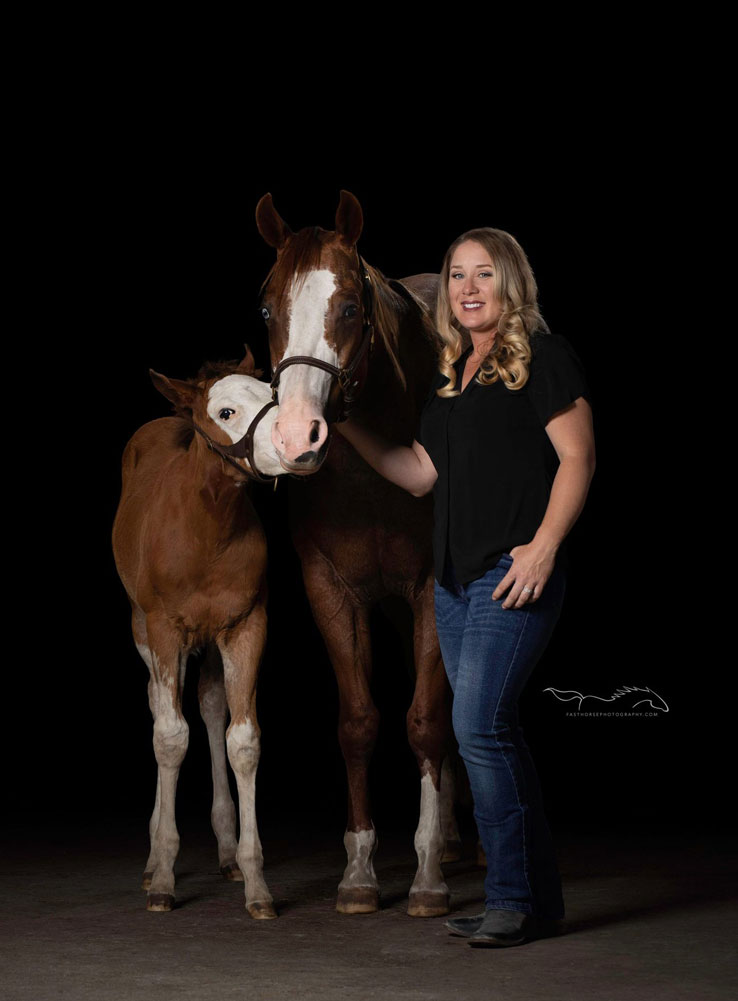 Woman with mare and foal